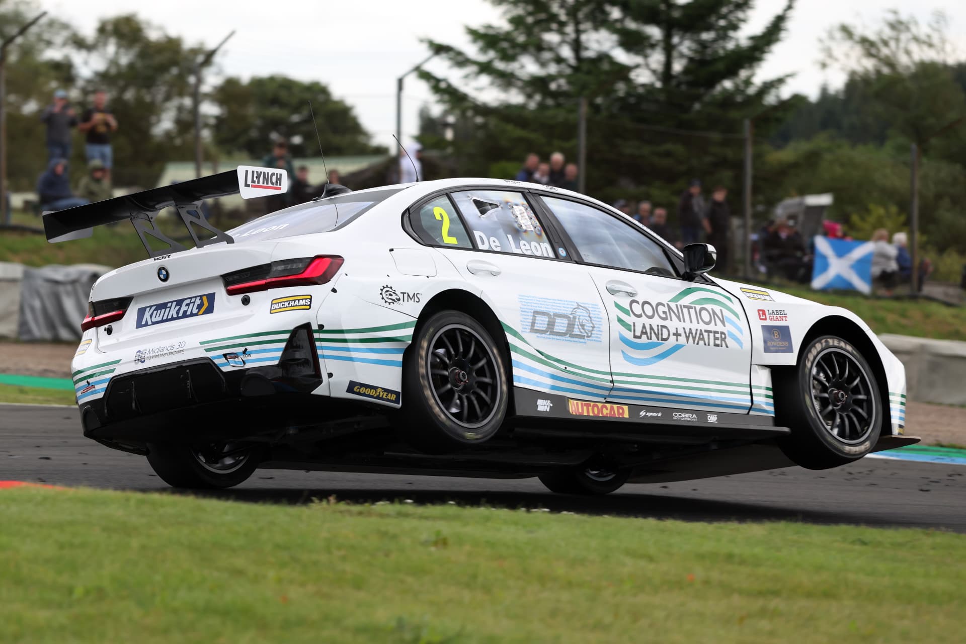 The #2 De Leon BTCC car riding the kerbs at speed