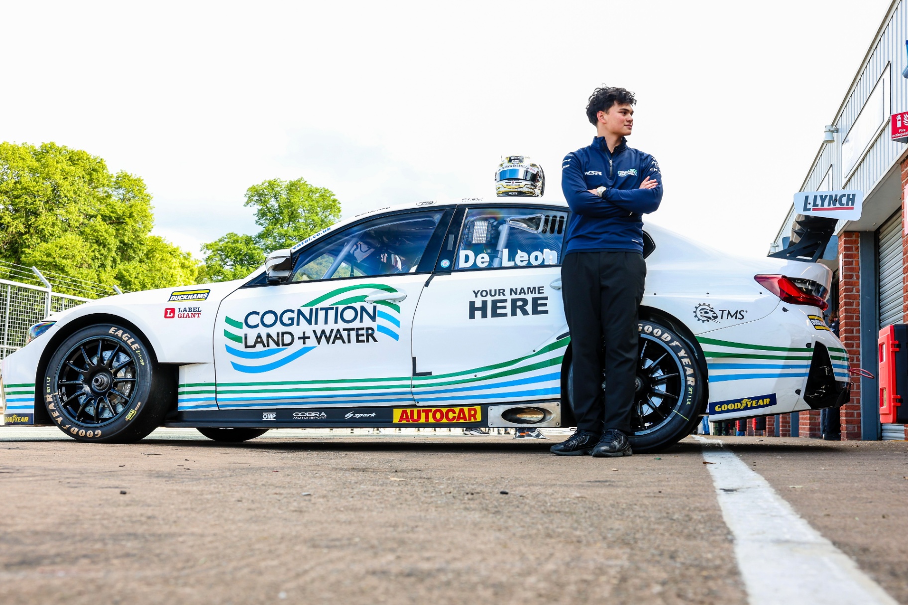 Daryl standing next to the BTCC car in the pit lane