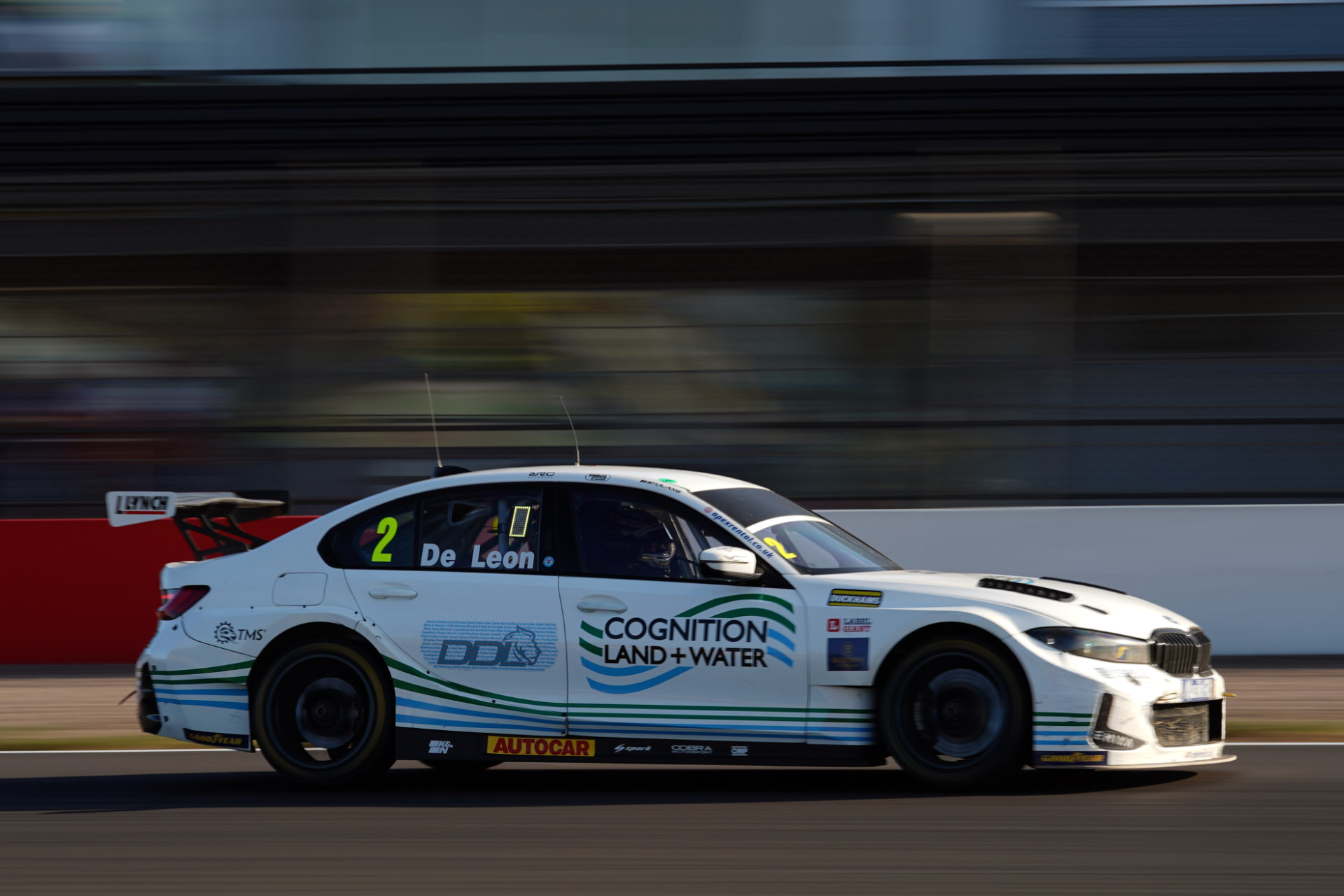 The #2 De Leon BTCC car panning shot along the pit straight
