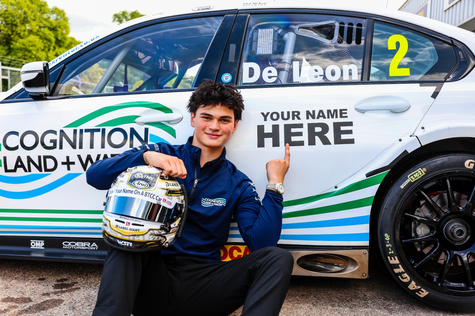Daryl pointing at 'Your Name Here' on the BTCC car